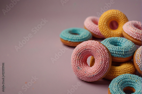 Crochet Amigurumi Donuts with Empty Space, Selective Focus - Perfect for use in creative projects, advertising, or as a whimsical decoration.