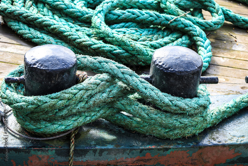 Old ropes and mooring post in the dockyard in Bristol city