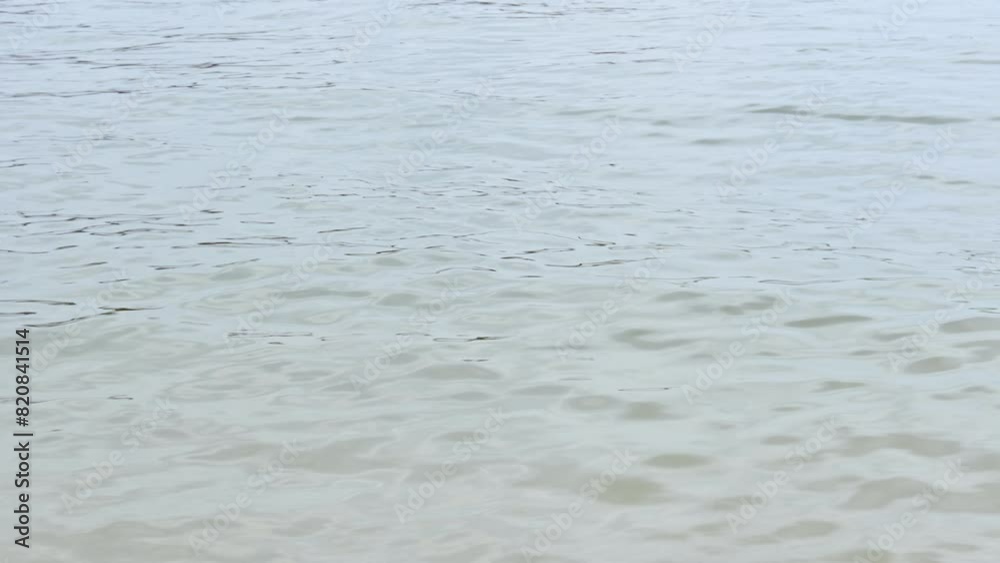 Water surface of Ganga river. This video is from the Ganga river banks of Varanasi. In India, the water of Gangaji is considered very holy, river Ganga is given the status of mother. Water surface of Ganga river. This video is from the Ganga river banks of Varanasi. In India, the water of Gangaji is considered very holy, river Ganga is given the status of mother.