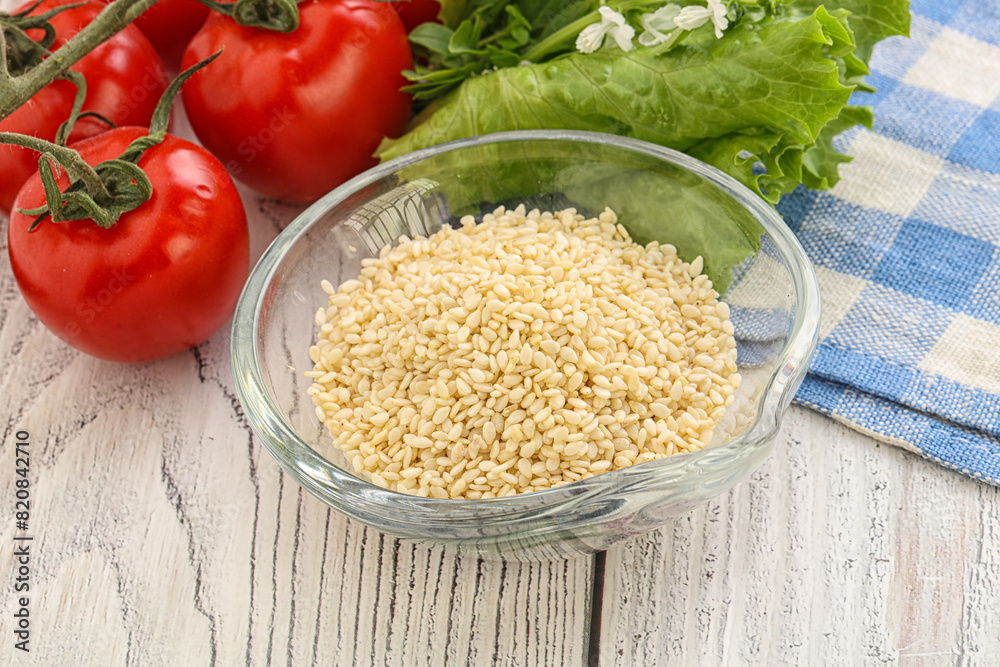 Raw sesame seeds in the bowl Raw sesame seeds in the bowl