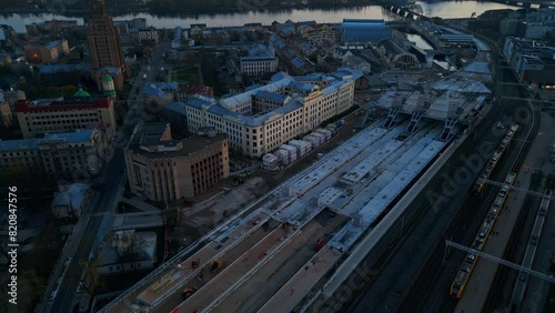 Wallpaper Mural Aerial view of a train station in a city during sunset, highlighting architecture, transportation, and city life Torontodigital.ca