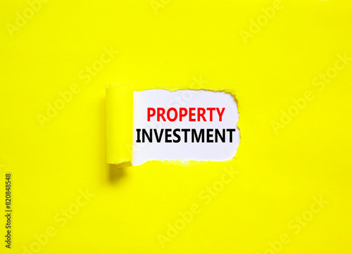 Property investment symbol. Concept words Property investment on beautiful white paper. Beautiful yellow paper background. Business Property investment concept. Copy space. © Dzmitry