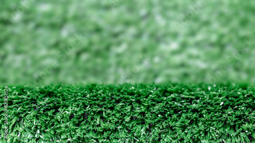 Artificial grass flooring for product placement