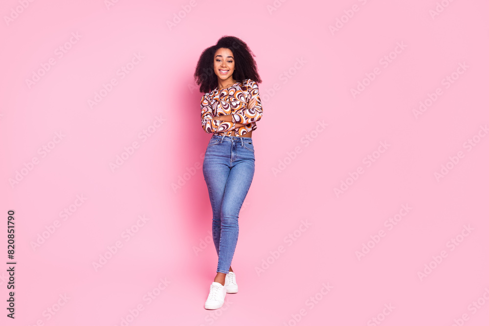 Full length photo of shiny attractive lady dressed print shirt arms crossed empty space isolated pink color background Full length photo of shiny attractive lady dressed print shirt arms crossed empty space isolated pink color background