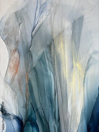Abstract blue background with gold and bronze — fluid art texture made with alcohol ink and liquid potal. Blue with gold natural art backdrop resembles watercolor or aquarelle.