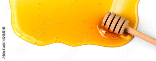 Honey dripping, pouring, flowing over white background with dipper, close-up. Healthy organic liquid sweet sticky honey dipping, isolated on white, closeup. Border design, top view
