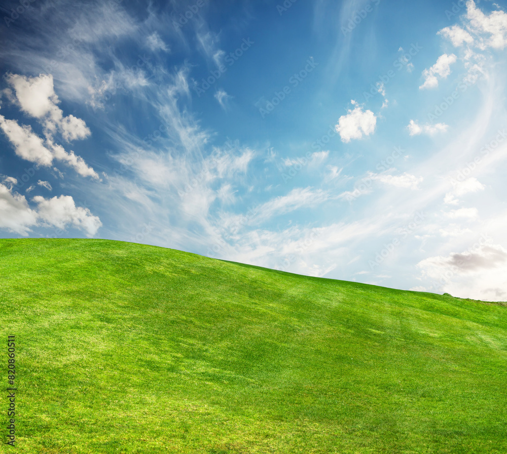 A sunny landscape unfolds, featuring meticulously trimmed green grass under a majestic sky A sunny landscape unfolds, featuring meticulously trimmed green grass under a majestic sky