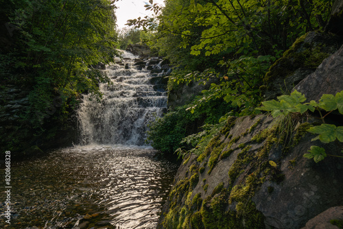 Woodland waterfall on the Ilabekken river by the city of Trondheim, Norway photo
