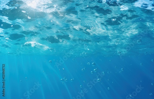 underwater and air bubbles on a blue water surface as seen from the air, light teal and sky blue, chillwave. © tydeline