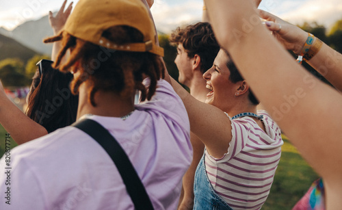 Crowd of excited music lovers celebrating unforgettable moments at a summer concert