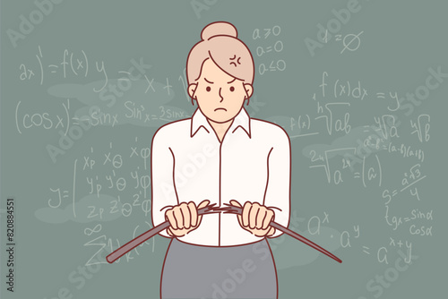 Angry woman teacher from high school breaks wooden pointer, standing near blackboard with formulas