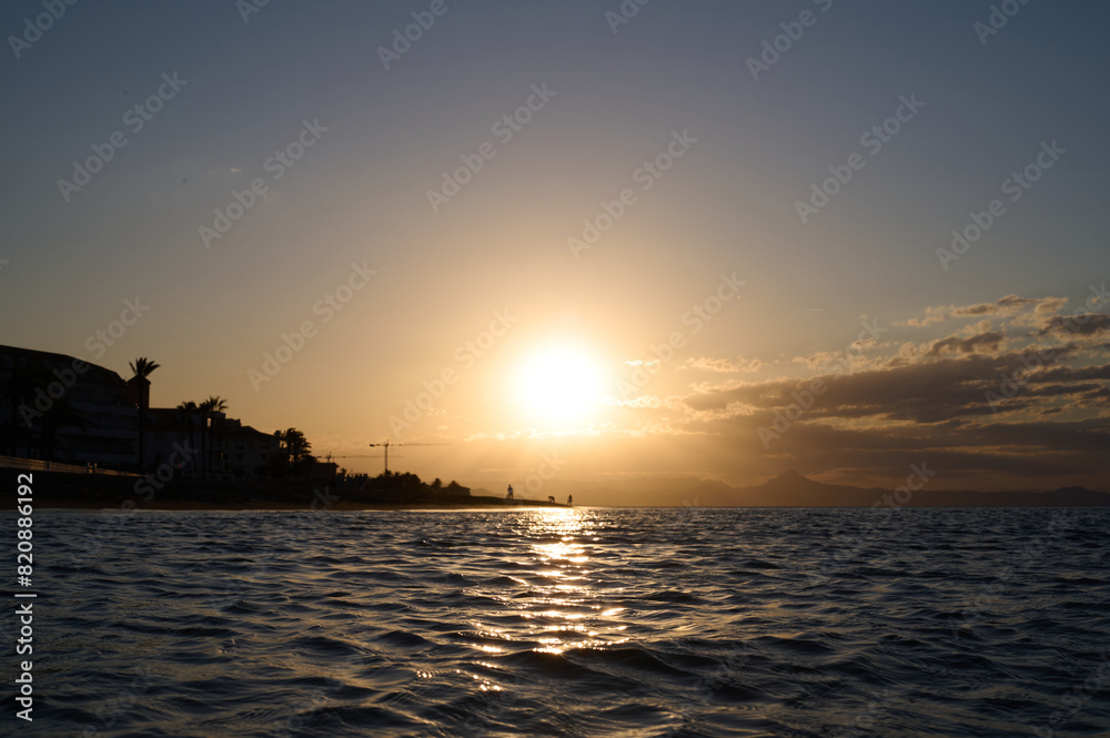 Naklejka premium Sunset on Les Bovetes beach, near Denia. Alicante. Valencian Community. Spain