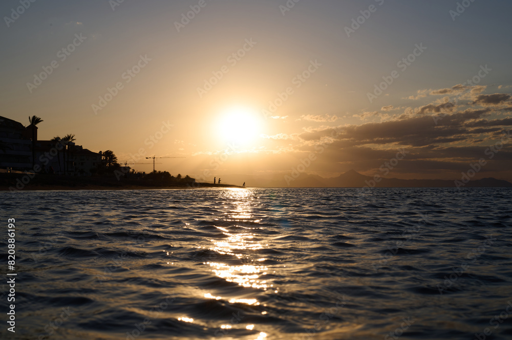 Sunset on Les Bovetes beach, near Denia. Alicante. Valencian Community. Spain Sunset on Les Bovetes beach, near Denia. Alicante. Valencian Community. Spain
