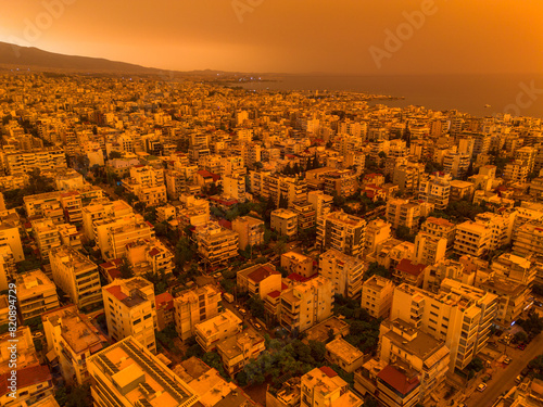 Athens,Greece,April 23,2024.Dust from Africa covers everything.View from a drone at sunset ,Palio Faliro,Greece