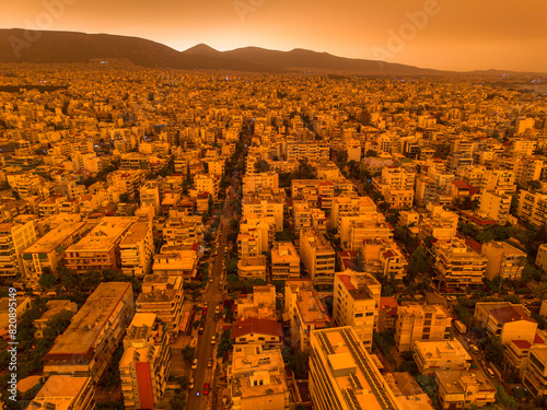 Athens,Greece,April 23,2024.Dust from Africa covers everything.View from a drone at sunset ,Palio Faliro,Greece