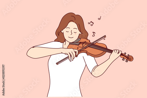 Woman plays violin, enjoying performance of classical melody and moving bow along strings of musical instrument. Girl learns to play violin, experiencing inspiration and coming up with own hits