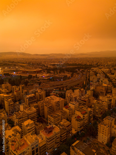 Athens,Greece,April 23,2024.Dust from Africa covers everything.View from a drone at sunset ,Palio Faliro,Greece