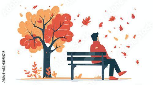 Man sitting on bench in autumn park enjoying fall loo