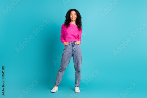 Full size photo of lovely young girl posing empty space wear pullover isolated on teal color background
