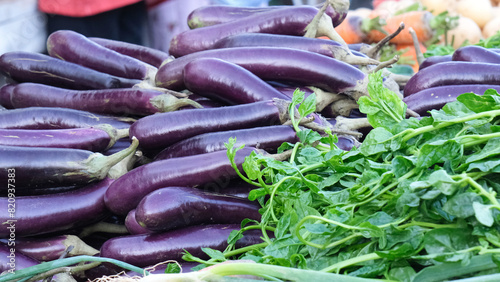 a display of fresh Brinjal and Philippine spinach.