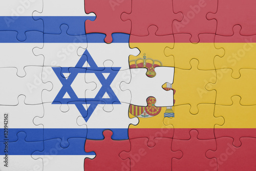 puzzle with the colourful national flag of spain and flag of israel.