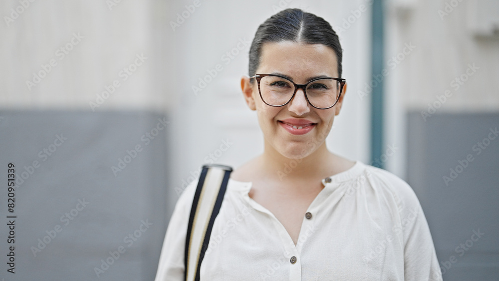 Young beautiful hispanic woman smiling confident standing at new house front door Young beautiful hispanic woman smiling confident standing at new house front door