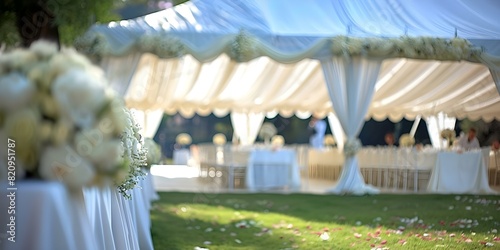 Outdoor wedding tent with white decorations awaiting guests for event design. Concept Outdoor Wedding Tent  White Decorations  Event Design  Guest Arrivals  Venue Decor