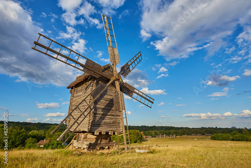 Traditional ukrainian windmill in the museum of national architecture in Pirogovo in a beautiful summer day, Kiev