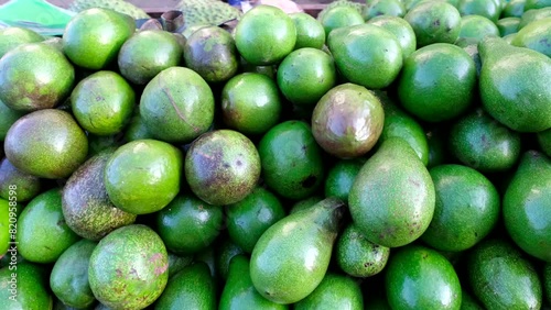 A display of Philippine ripe avocados, although it is green they are ready to eat. photo