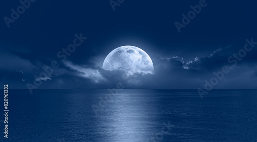 Fototapeta Naklejka Na Ścianę i Meble -  Night sky with full moon in the clouds 