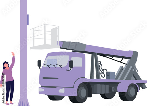 The girl is standing next to the electric truck.