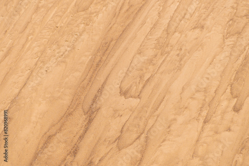 Sand mounds. Sandy natural background. Lines in the sand.