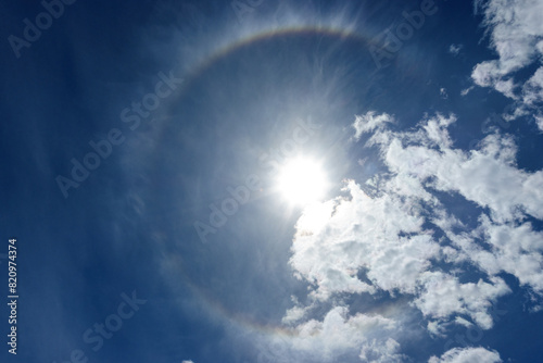 Natural Phenomenon Solar Halo. Rainbow Around Sun with Clouds. Atmospheric Effect