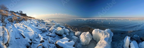 Early morning light illuminating icy shores and frozen waters. photo