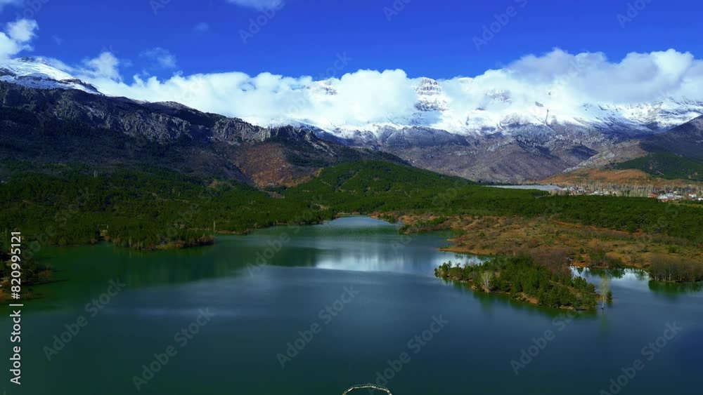 snowy mountains, spring season and wonderful reflections and views on the lake snowy mountains, spring season and wonderful reflections and views on the lake