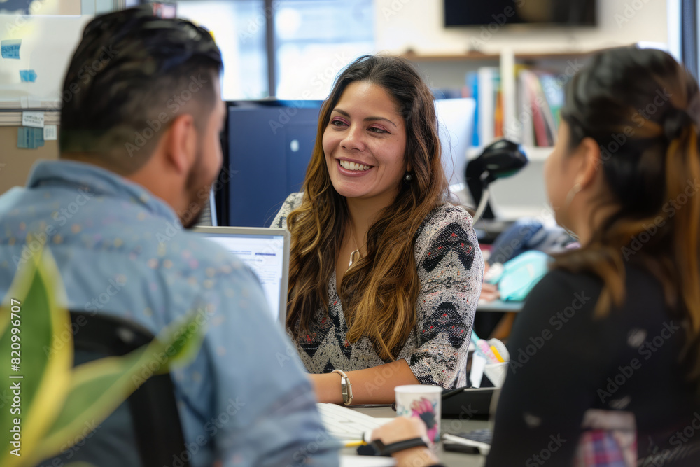 Fototapeta premium Hispanic woman manager mentoring team members in startup office.