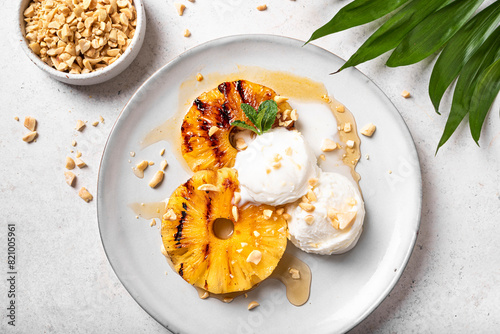 Grilled pineapples with icecream, tropical dessert