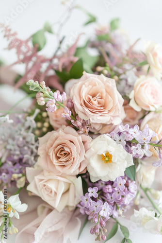Small bouquet with pastel flowers on white background © Veniamin Kraskov