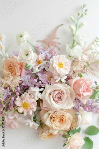 Small bouquet with pastel flowers on white background