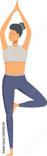 Serene woman in sportswear maintaining balance in the vrikshasana yoga pose