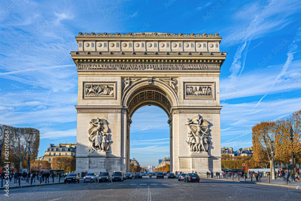 The Arc de Triomphe standing tall at the end of the Champs-Elysees in Paris