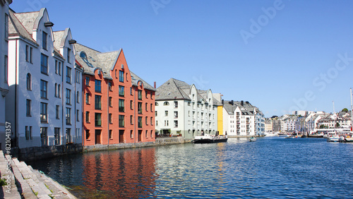 Cityscape of Alesund city on a sunny summer day, Norway. View of colorful Art Nouveau architecture port.