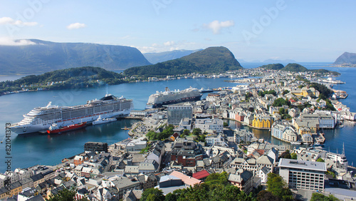 Cityscape of Alesund city on a sunny summer day, Norway. Aerial view of colorful Art Nouveau architecture port from the mount Aksla.
