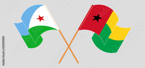 Crossed and waving flags of Djibouti and Guinea-Bissau