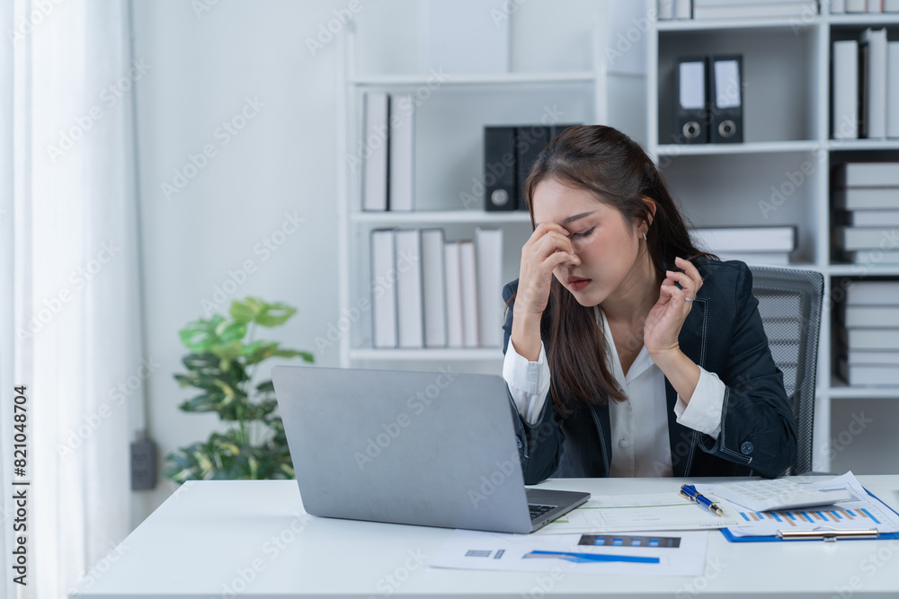 Stress at work, sitting with a stressed face, standing and stretching the body of an office woman. Stress at work, sitting with a stressed face, standing and stretching the body of an office woman.