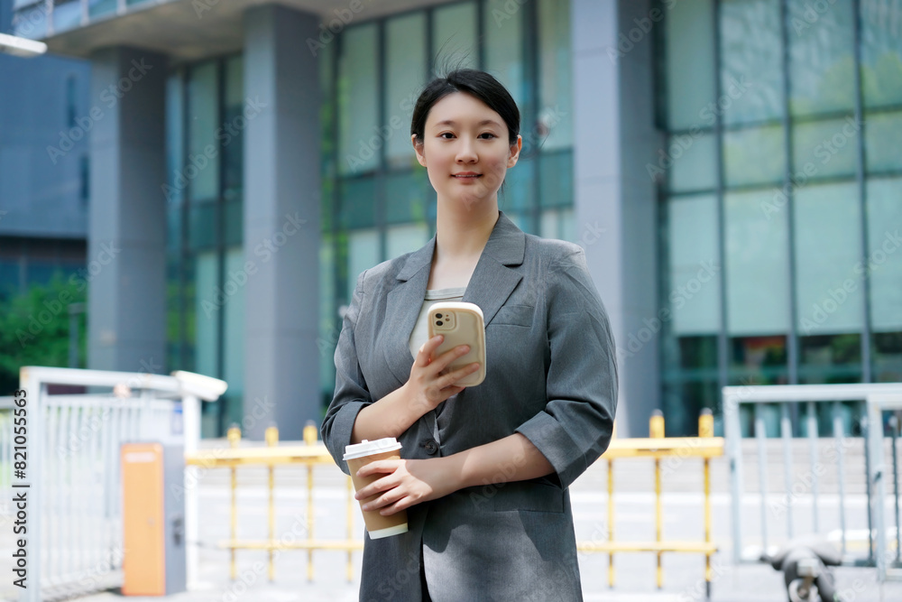 Confident Businesswoman Using Smartphone Outdoors Confident Businesswoman Using Smartphone Outdoors