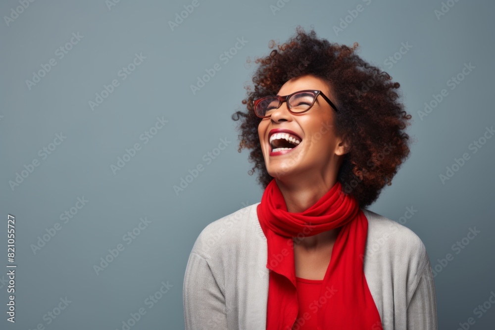 Portrait of a cheerful afro-american woman in her 50s laughing in minimalist or empty room background Portrait of a cheerful afro-american woman in her 50s laughing in minimalist or empty room background