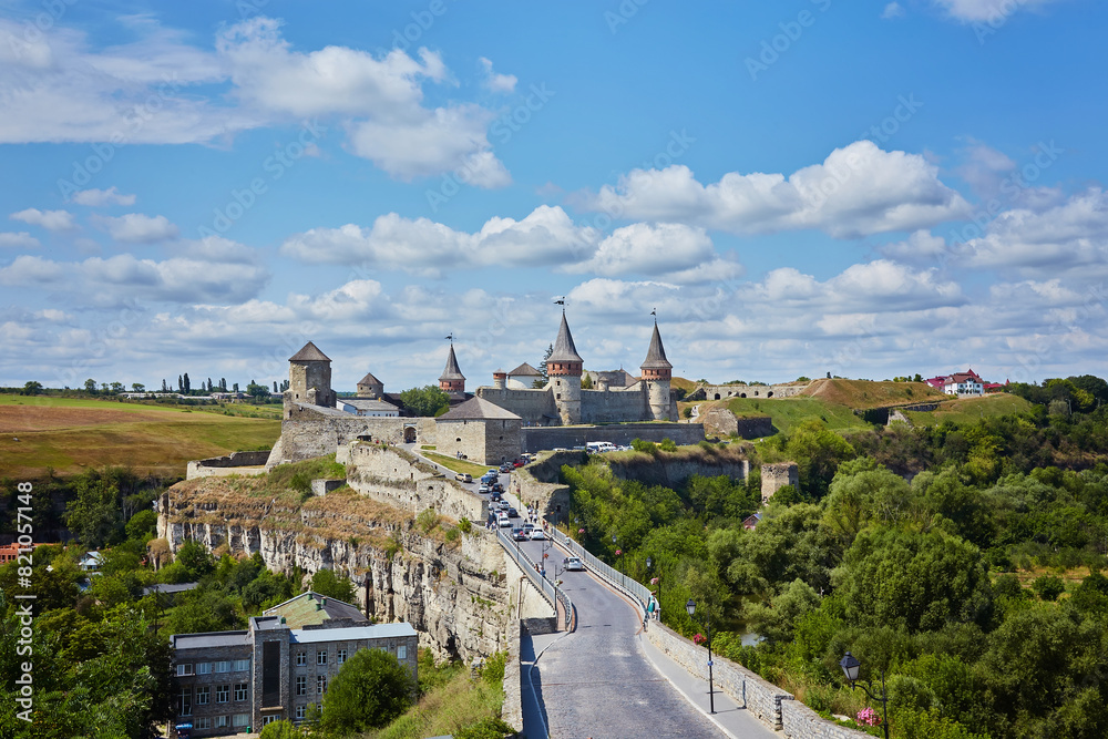 Naklejka premium Dramatic view on the castle in Kamianets-Podilskyi in spring.