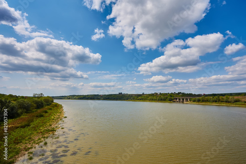 River summer landscape with bright blue sky.