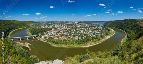 Top picturesque view of the spring Dnister river bend canyon and famous Ukrainian Zalischyky town. Ternopil region, Ukraine. photo